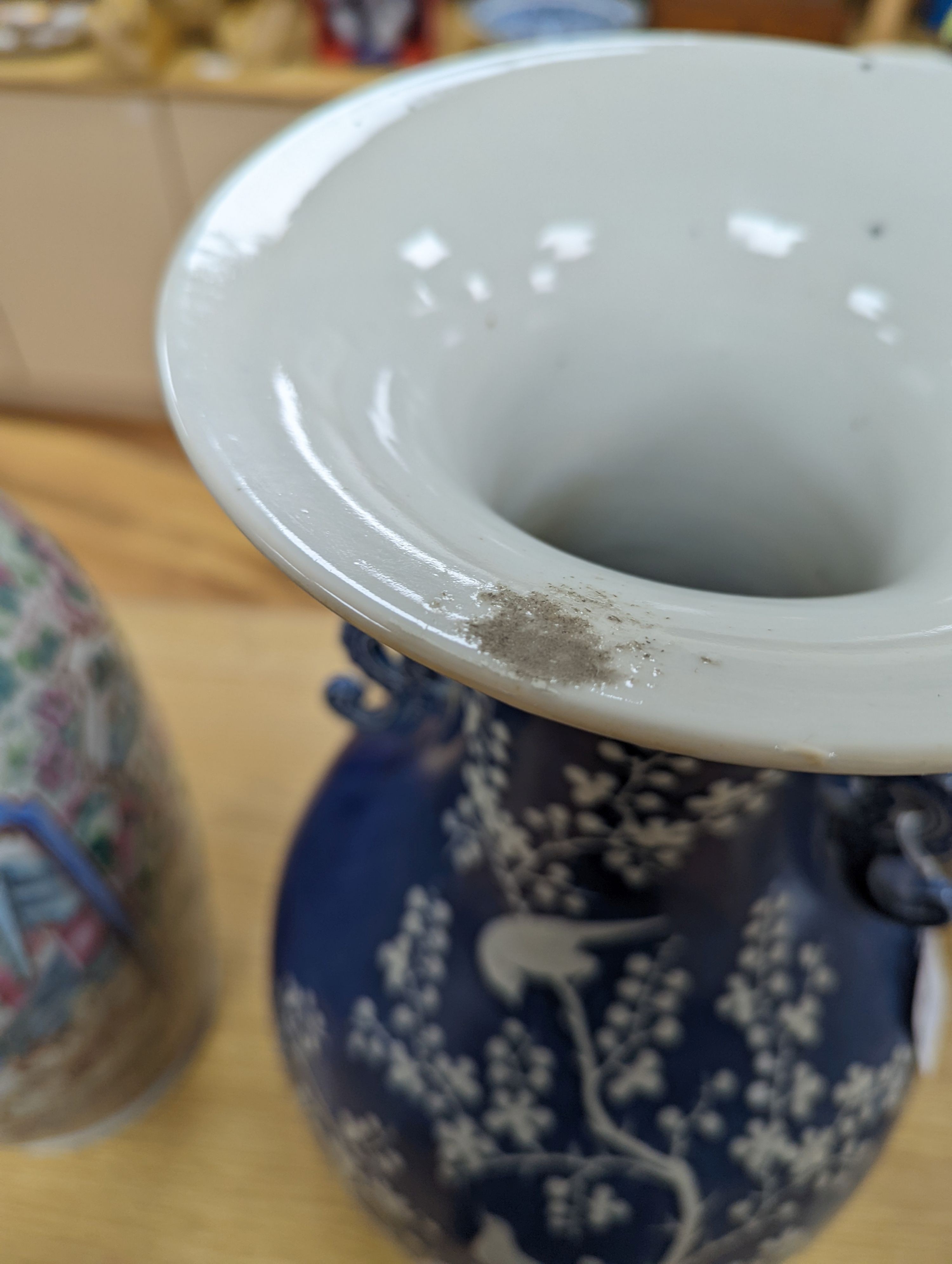 A pair of large 19th century Chinese slip decorated blue ground vases, restored, 59cm